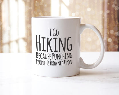 Funny Hiking Mug: "I Go Hiking Because Punching People Is Frowned Upon"
